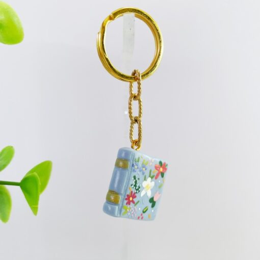 Sleutelhanger boek lichtblauw bloemen