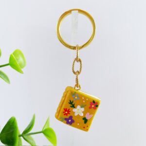 Sleutelhanger boek oker bloemen
