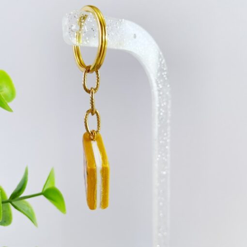 Sleutelhanger boek oker bloemen